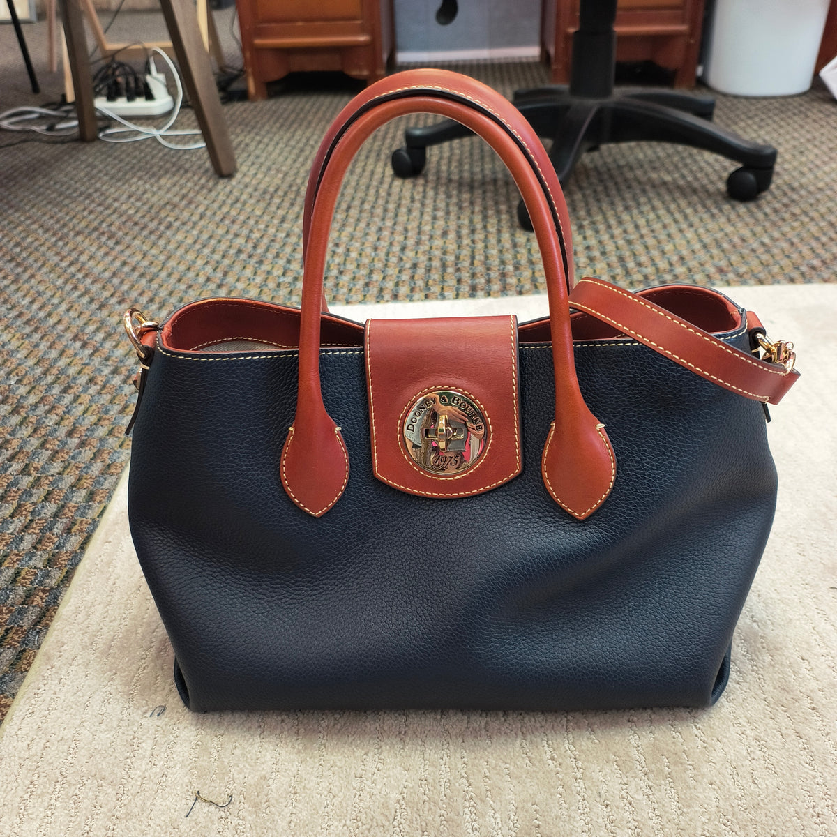 D)Dooney & Bourke bag 10/29/26